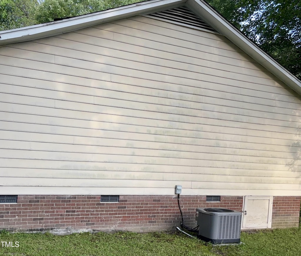 109 Grange Dr, Wendell, NC 27591 - view of home's exterior featuring crawl space and central air condition unit