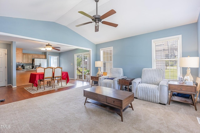 6 N Carolina Ave, Benson, NC 27504 - living room with ceiling fan, vaulted ceiling, and light carpet
