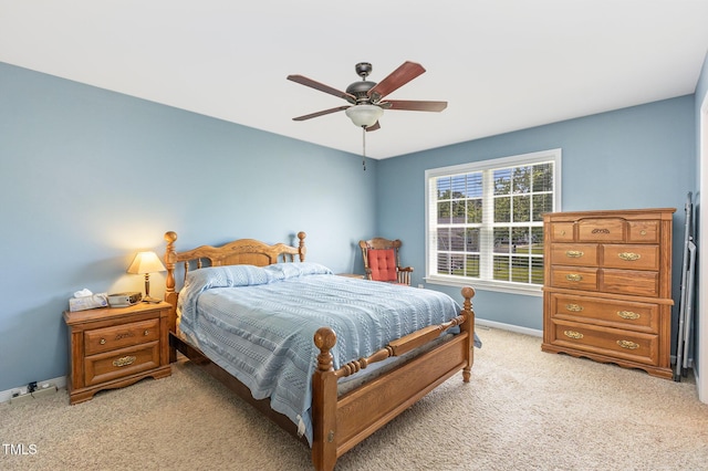 6 N Carolina Ave, Benson, NC 27504 - bedroom with light carpet, baseboards, and a ceiling fan