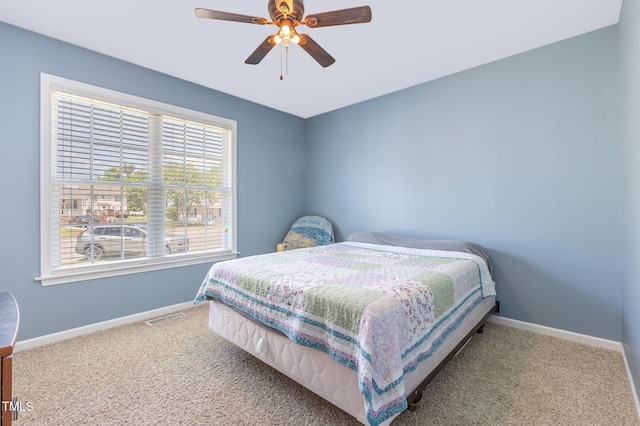 6 N Carolina Ave, Benson, NC 27504 - carpeted bedroom with baseboards and ceiling fan