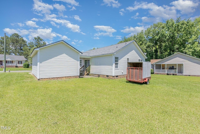 6 N Carolina Ave, Benson, NC 27504 - rear view of house featuring a yard, crawl space, and a shingled roof