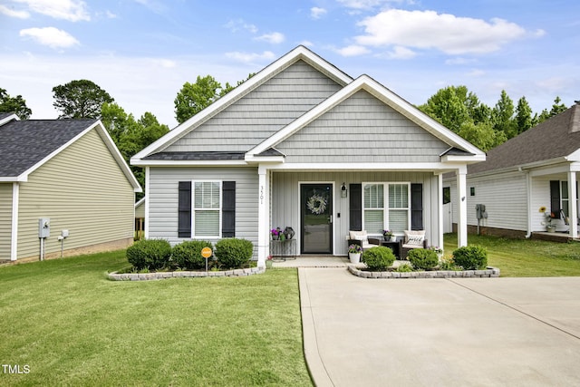 3501 Cranberry Ridge Dr SW, Wilson, NC 27893 - view of front of property featuring a porch, a front yard, and board and batten siding
