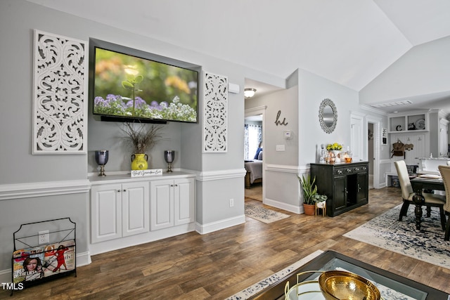 3501 Cranberry Ridge Dr SW, Wilson, NC 27893 - living room featuring wood finished floors, vaulted ceiling, and baseboards