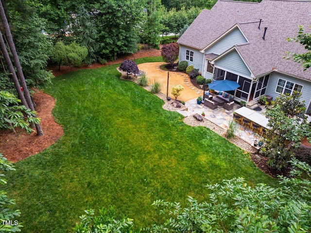 201 Margaret Mann Way, Pittsboro, NC 27312 - view of green lawn with a sunroom and a patio