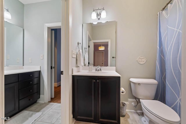 201 Margaret Mann Way, Pittsboro, NC 27312 - full bathroom featuring vanity, toilet, and baseboards