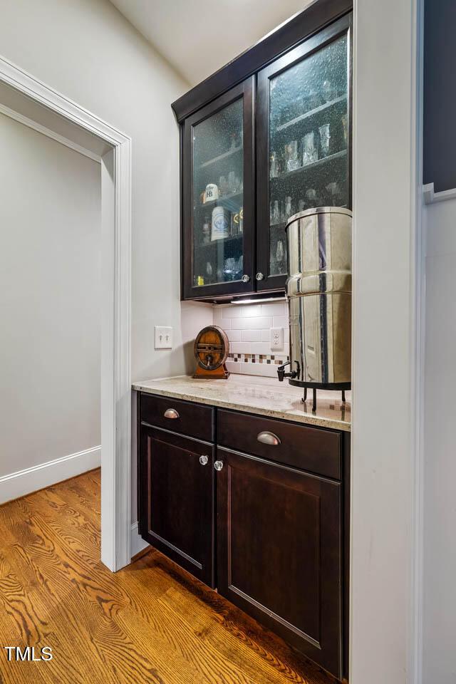 201 Margaret Mann Way, Pittsboro, NC 27312 - bar featuring wood finished floors and backsplash