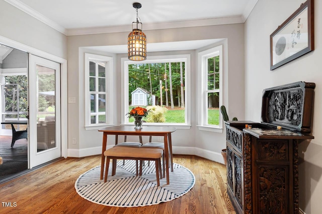 201 Margaret Mann Way, Pittsboro, NC 27312 - dining room with light wood finished floors, baseboards, and ornamental molding