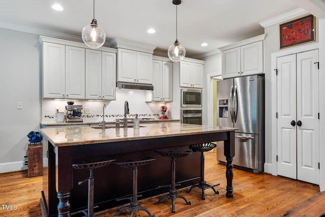 201 Margaret Mann Way, Pittsboro, NC 27312 - kitchen with stainless steel appliances, crown molding, a sink, tasteful backsplash, and light stone countertops