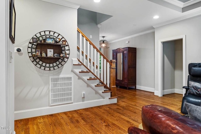 201 Margaret Mann Way, Pittsboro, NC 27312 - staircase featuring wood finished floors, crown molding, baseboards, and recessed lighting