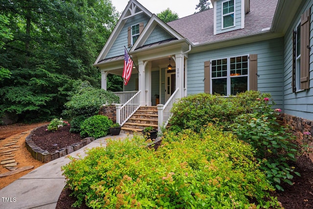 201 Margaret Mann Way, Pittsboro, NC 27312 - view of front facade featuring covered porch and a shingled roof