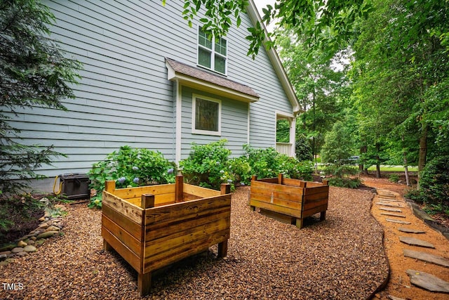 201 Margaret Mann Way, Pittsboro, NC 27312 - view of patio / terrace featuring a garden and central air condition unit