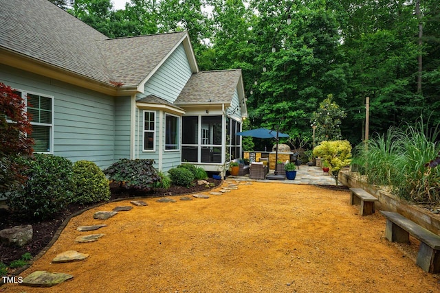 201 Margaret Mann Way, Pittsboro, NC 27312 - view of yard featuring a sunroom and a patio