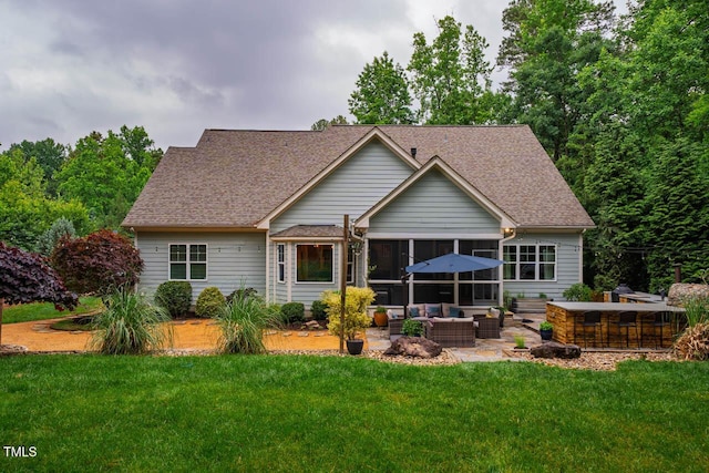 201 Margaret Mann Way, Pittsboro, NC 27312 - rear view of property with an outdoor living space, a sunroom, a yard, a patio area, and a shingled roof