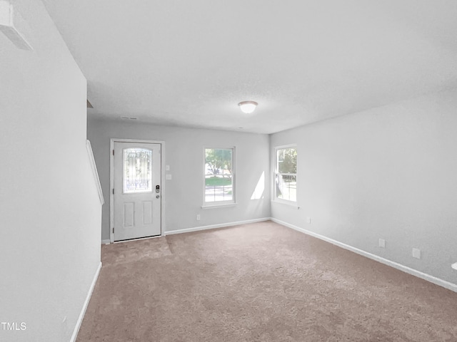 2705 Ramblegate Ln, Durham, NC 27705 - foyer entrance with baseboards and carpet floors