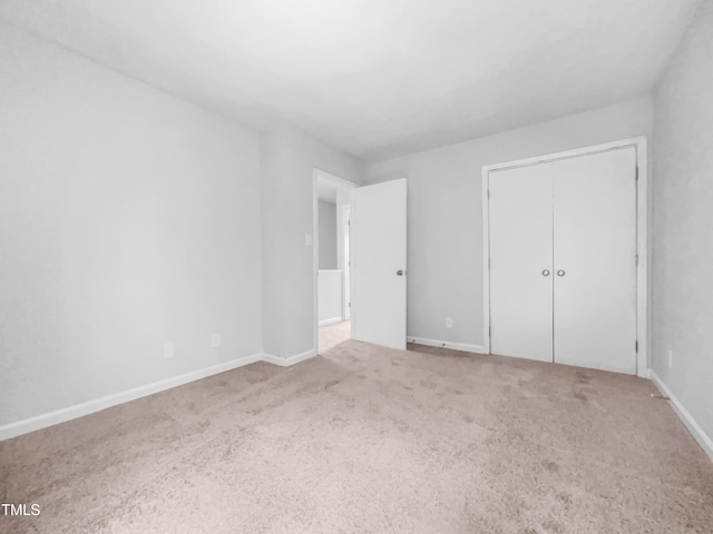 2705 Ramblegate Ln, Durham, NC 27705 - unfurnished bedroom with carpet, baseboards, and a closet