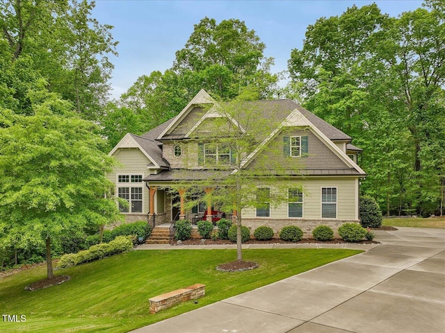 374 Crimson Way, Pittsboro, NC 27312 - craftsman-style house with a porch, a front lawn, and brick siding