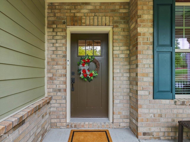 374 Crimson Way, Pittsboro, NC 27312 - doorway to property with brick siding