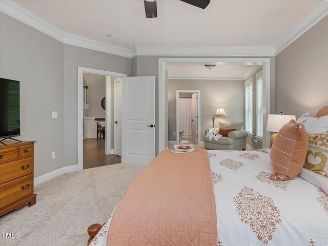 374 Crimson Way, Pittsboro, NC 27312 - bedroom featuring ornamental molding, baseboards, carpet flooring, ceiling fan, and ensuite bath
