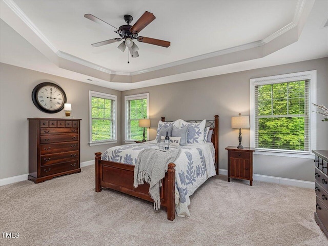 374 Crimson Way, Pittsboro, NC 27312 - carpeted bedroom with a tray ceiling, ornamental molding, multiple windows, baseboards, and ceiling fan