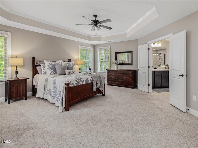 374 Crimson Way, Pittsboro, NC 27312 - bedroom featuring a tray ceiling, light carpet, multiple windows, crown molding, and baseboards