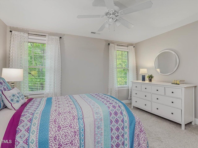 374 Crimson Way, Pittsboro, NC 27312 - bedroom with light colored carpet, ceiling fan, and baseboards
