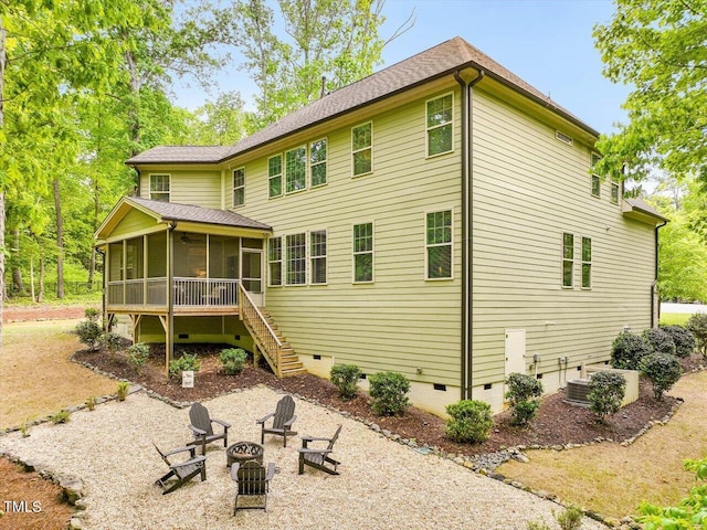 374 Crimson Way, Pittsboro, NC 27312 - rear view of house featuring crawl space, an outdoor fire pit, a sunroom, stairway, and a patio area