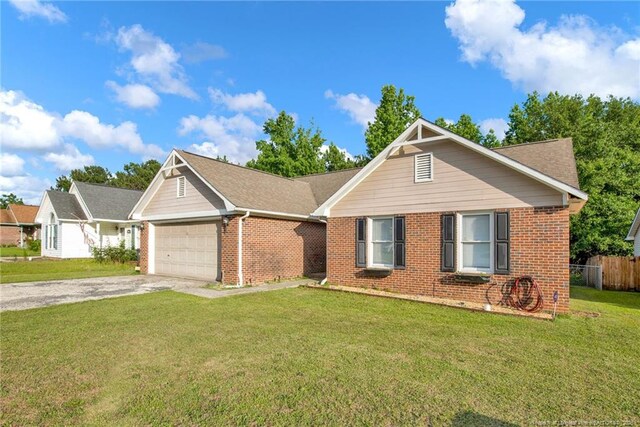 5921 Bloomsbury Dr, Fayetteville, NC 28306 - ranch-style house featuring an attached garage, brick siding, and driveway
