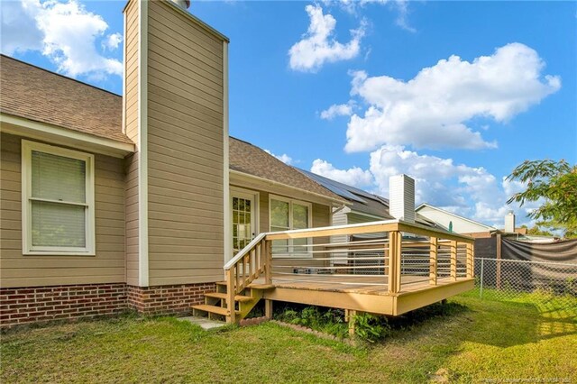 5921 Bloomsbury Dr, Fayetteville, NC 28306 - rear view of property featuring a chimney, a deck, and a shingled roof