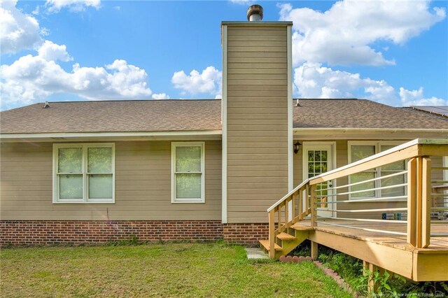 5921 Bloomsbury Dr, Fayetteville, NC 28306 - back of house featuring a chimney, a yard, and roof with shingles