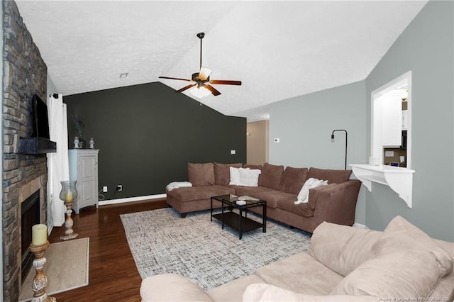 5921 Bloomsbury Dr, Fayetteville, NC 28306 - living room featuring a ceiling fan, wood finished floors, a fireplace, vaulted ceiling, and an accent wall