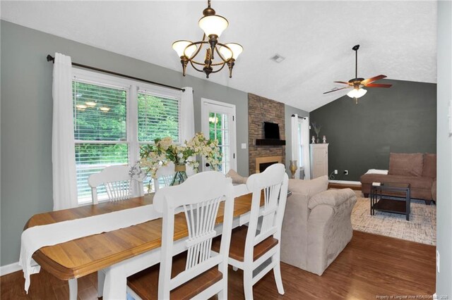 5921 Bloomsbury Dr, Fayetteville, NC 28306 - dining room featuring vaulted ceiling, wood finished floors, ceiling fan, a chandelier, and baseboards