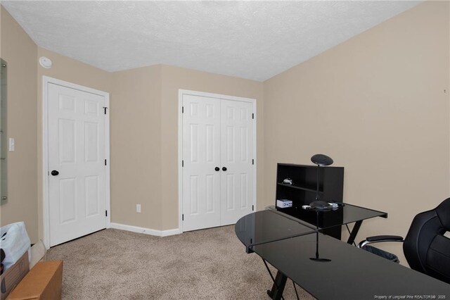 5921 Bloomsbury Dr, Fayetteville, NC 28306 - office area featuring carpet floors, baseboards, and a textured ceiling
