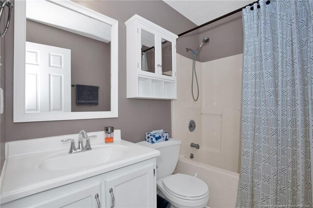 5921 Bloomsbury Dr, Fayetteville, NC 28306 - bathroom with shower / bath combo with shower curtain, toilet, and vanity
