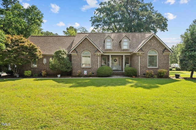 5924 Finish Line Dr, Hope Mills, NC 28348 - cape cod home featuring a front yard, brick siding, and crawl space