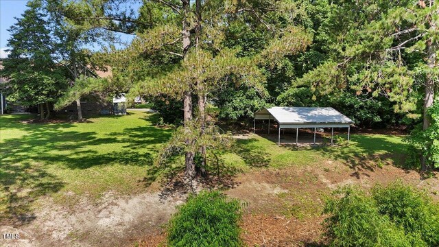 5924 Finish Line Dr, Hope Mills, NC 28348 - view of grassy yard with a detached carport
