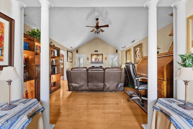 5924 Finish Line Dr, Hope Mills, NC 28348 - living area featuring decorative columns, ceiling fan, lofted ceiling, and light wood-style flooring