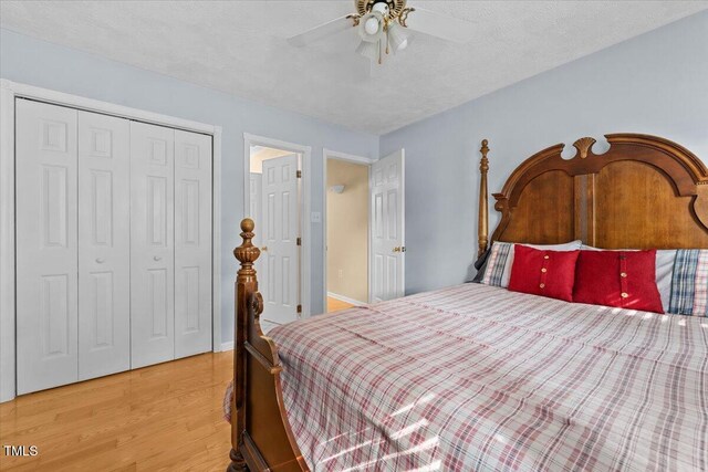 5924 Finish Line Dr, Hope Mills, NC 28348 - bedroom featuring light wood-type flooring, a closet, and a ceiling fan