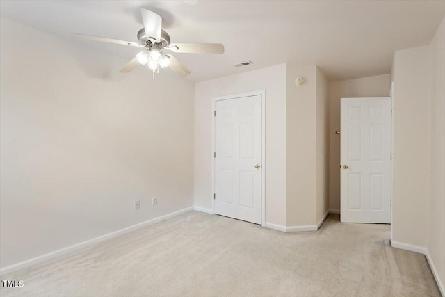 402 Halls Mill Dr, Cary, NC 27519 - unfurnished bedroom featuring light colored carpet, baseboards, and ceiling fan