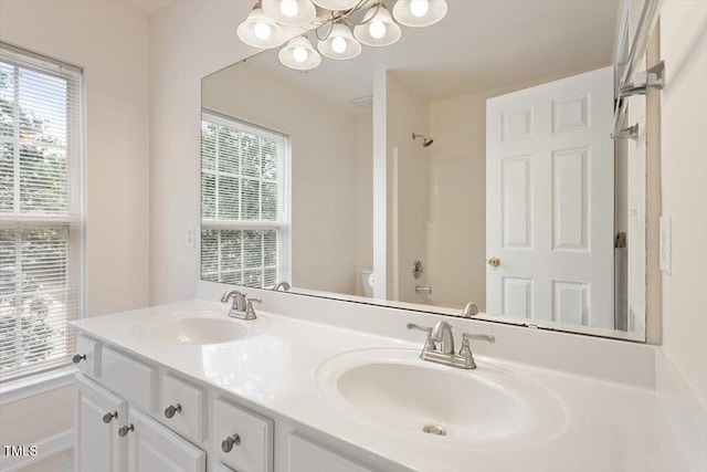 402 Halls Mill Dr, Cary, NC 27519 - bathroom with a chandelier, double vanity, healthy amount of natural light, and toilet