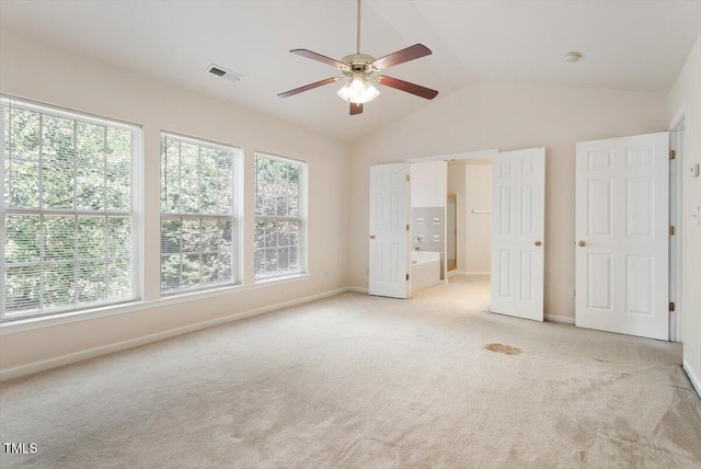 402 Halls Mill Dr, Cary, NC 27519 - unfurnished bedroom with multiple windows, light carpet, and vaulted ceiling