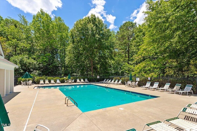402 Halls Mill Dr, Cary, NC 27519 - community pool with a patio area and view of scattered trees