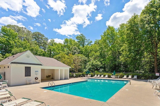 402 Halls Mill Dr, Cary, NC 27519 - community pool with a patio area and view of wooded area