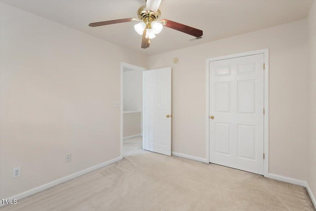 402 Halls Mill Dr, Cary, NC 27519 - unfurnished bedroom featuring light colored carpet, baseboards, and a ceiling fan