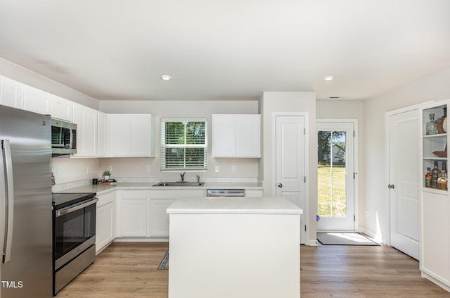 8840 Shallow Creek Trl, Bailey, NC 27807 - kitchen featuring stainless steel appliances, a sink, a kitchen island, light countertops, and recessed lighting