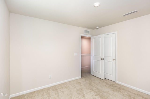 8840 Shallow Creek Trl, Bailey, NC 27807 - unfurnished bedroom featuring carpet, baseboards, and a closet