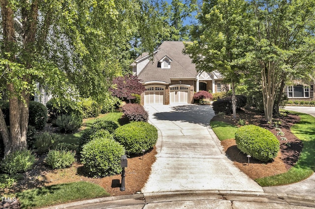 84307 Winslow, Chapel Hill, NC 27517 - view of front of property featuring driveway, brick siding, and a shingled roof