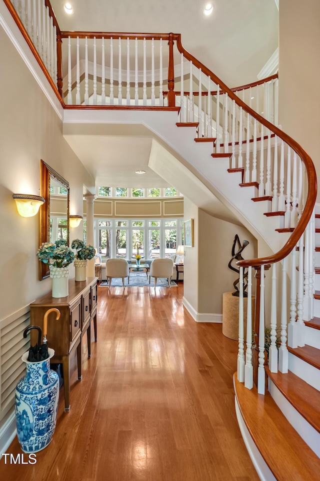 84307 Winslow, Chapel Hill, NC 27517 - foyer with a towering ceiling, wood-type flooring, stairway, and recessed lighting