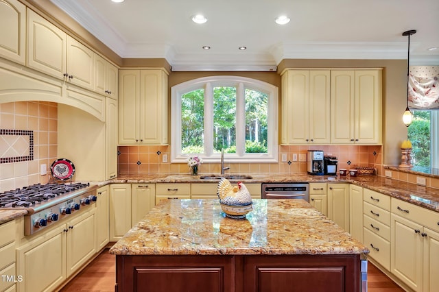 84307 Winslow, Chapel Hill, NC 27517 - kitchen featuring stainless steel appliances, cream cabinetry, light stone countertops, tasteful backsplash, and ornamental molding
