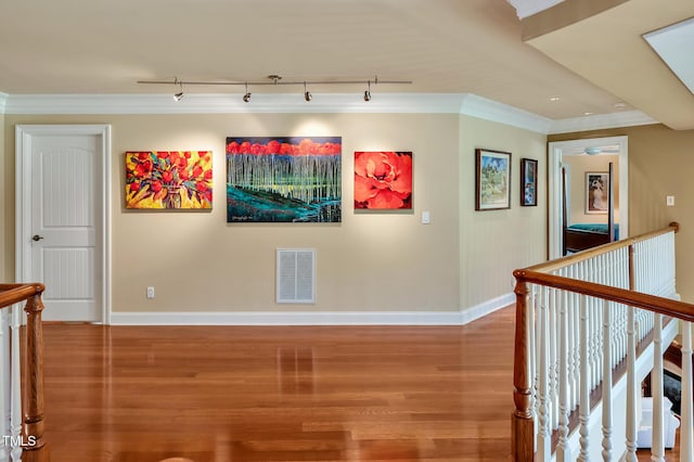 84307 Winslow, Chapel Hill, NC 27517 - corridor with an upstairs landing, wood finished floors, track lighting, and ornamental molding