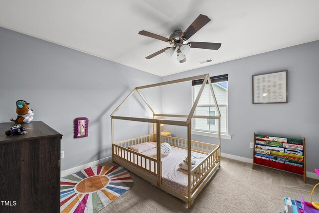 2909 Landon Pines Ct, New Hill, NC 27562 - carpeted bedroom featuring baseboards and a ceiling fan